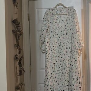 a new day tiered dress , background white, pink, teal, and navy design